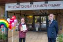 Kevin Watts, headteacher of Great Dunmow Primary School, pictured with the awards and Great Dunmow Town Council mayor Mike Coleman.