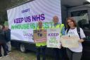 Action - Tracy Lavery, Mark Woodugle and Natalia Junusz all with signs