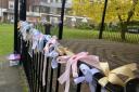 Ribbons tied to the bandstand in memory of babies in Saffron Walden