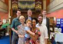 Reverend Mark Hayes, newly ordained at Thaxted United Reformed Church, with his family