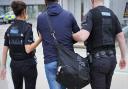 Essex Police arrested a 55-year-old man as he stepped off a flight from Belgium at Stansted Airport