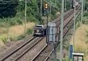 A black Land Rover Discovery sped onto railway tracks near Cheshunt during a police chase