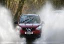 Cars make their way through flood water near Chediston in Suffolk. Picture: JOE GIDDENS/PA WIRE