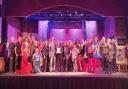 The cast of Saffron Walden Musical Theatre Company's production of Kinky Boots back in March, when SWMTC members were presented with their centenary certificate from NODA.