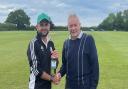 Stock`s Dave Cole receiving the Aythorpe Roding president's man of the match award from Brian Hockley.