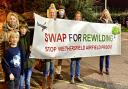 Archive image: Stop Wethersfield Airfield Prisons protestors show off their banner at Braintree District Council