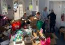 People helping Saffron Walden resident Kateryna Shotropa pack donated items which have been boxed up and driven to the Ukraine border