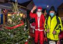 Santa Claus and Revd Dr Colin Fairweather wish residents a merry Christmas