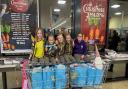 Amy, 9, Erika, 8, Emily, 8, Bella, 8, and Maddie, 9, shopping on behalf of the 1st Thaxted Brownie Unit for Uttlesford Foodbank