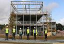 In front of the steel frame at the new Great Notley Enterprise Centre: Cllr Tom Cunningham (Deputy Leader, Braintree District Council), Adam Bryan (CEO, South East LEP), Ian Gifford (Operations Director, Kier), Cllr Kevin Bowers (Cabinet Member for