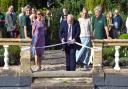 Councillor Martin Foley of Uttlesford District Council and Essex County Council cuts the ribbon at the Gardens of Easton Lodge, Little Easton, to mark the completion of the restoration project in Little Easton