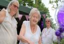 Florence Manly of Felsted (centre) cuts her 105th birthday cake