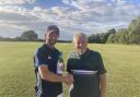 Graham Milbank receives his man of the match award from president Brian Hockley. Picture:  ARCC