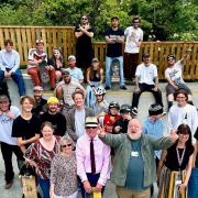 Cllr Martin Foley, front row with hands in the air, with members of Thaxted Youth Club at the opening of the new skatepark