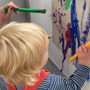 A child playing on Buffy Playbus in Uttlesford