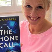 Author AJ Campbell with her new book called The Phone Call