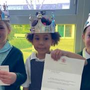 Students at The Flitch Green Academy, Little Dunmow, with a letter from Windsor Castle