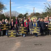 Residents with signs reading 