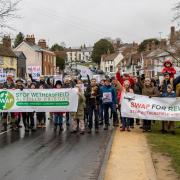 Stop Wethersfield Airfield Prisons (SWAP) campaign supporters in Great Bardfield with their banners