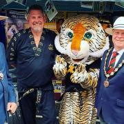 Great Dunmow mayor Patrick Lavelle (far right) with deputy mayor Alex Armstrong, and members of Dunmow Tae Kwon-Do at Great Dunmow Summer Market