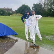 Jack Stevens and Sam Gravatt help sort out Aythorpe Roding Cricket Club's unwanted new swimming pool.