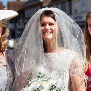 Farleigh Hospice charity shop in Great Dunmow is focussed on wedding and prom related items. Debbie de Boltz in a Mother of the bride dress £20, hat £6.50. Caroline Smith in a Bride's dress £200 (new with tags). Mia Smith in a Bridesmaid dress £20.