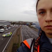 Climate change activists climb M25 gantries as commuters face road closure