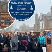 Plaque unveiled: family members gathered the see the new plaque