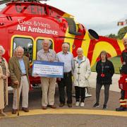 Raised - organisers Pat Hughes, Mac Beanland, Richard Hughes and David and Primrose Hunt with Clair Mitchell and a paramedic crew member