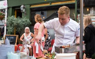 MasterChef winner Alex Webb cooking lobster and prawns on a BBQ for the Great Dunmow summer market