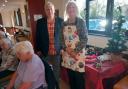 Singer Alan Reynolds (centre) with club member Barbara Warton, standing next to members Cherry Scott and Jean Baker