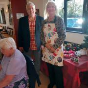 Singer Alan Reynolds (centre) with club member Barbara Warton, standing next to members Cherry Scott and Jean Baker